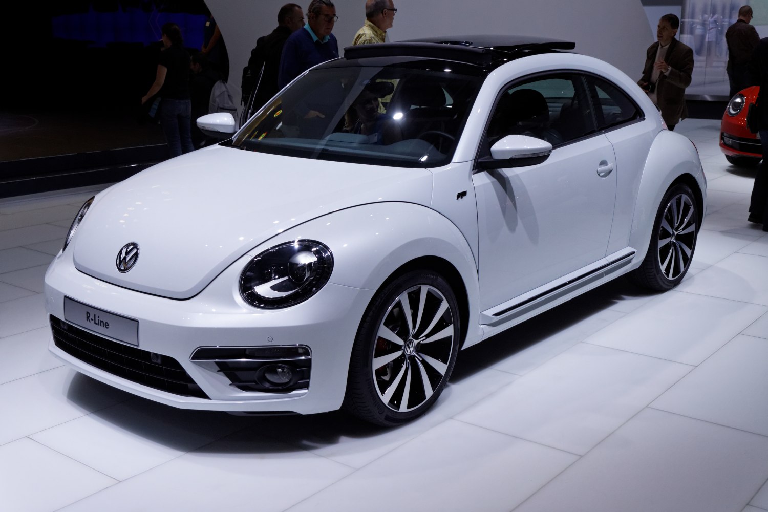 White hatchback with panoramic sunroof and stylish alloy wheels