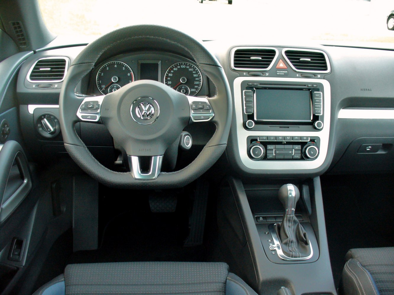 Dashboard and multifunction steering wheel with center console and gear shifter