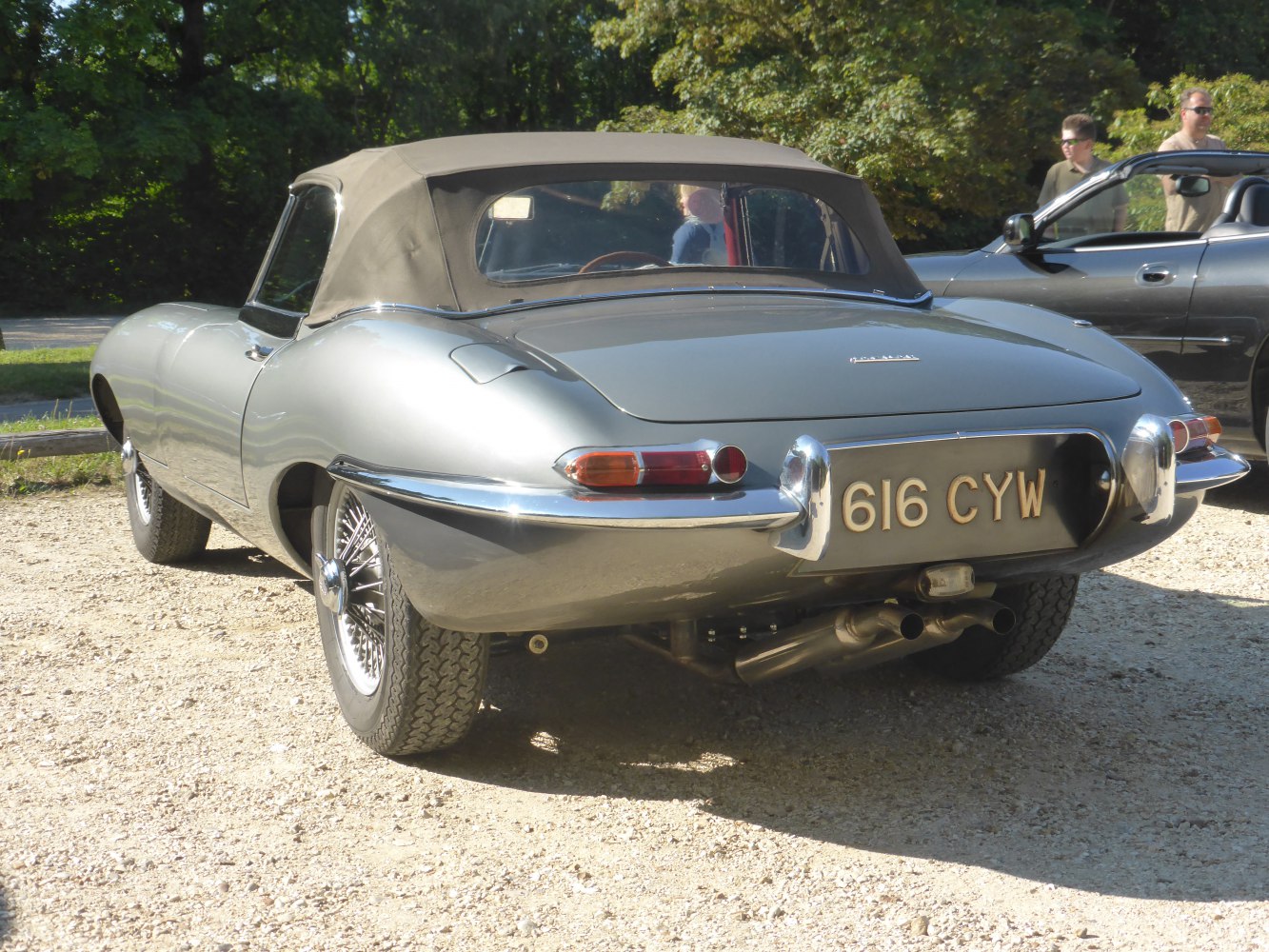 Rear view of classic convertible with wire wheels and soft top roof