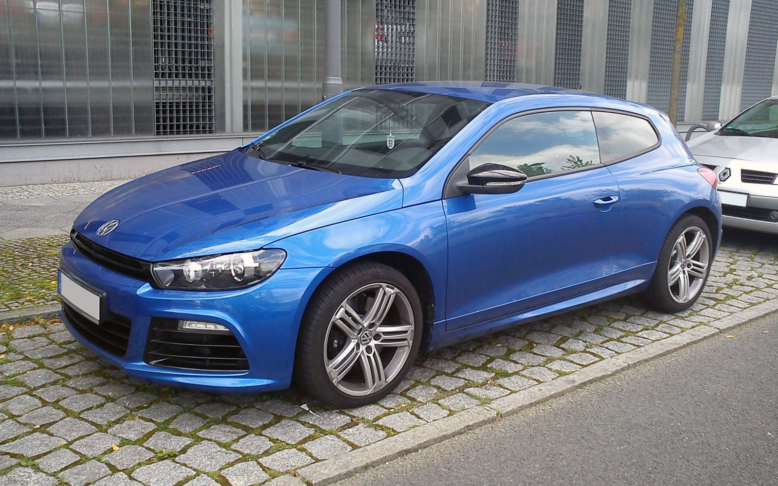 Blue compact sports coupe, front and side profile view