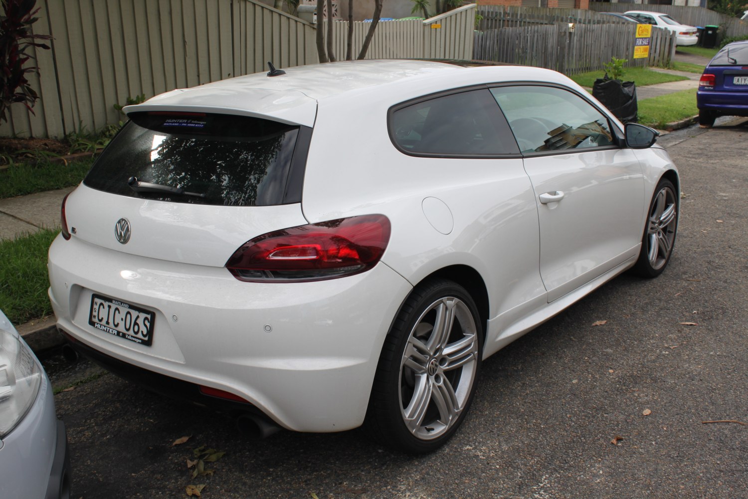 Sporty hatchback rear and side view with alloy wheels