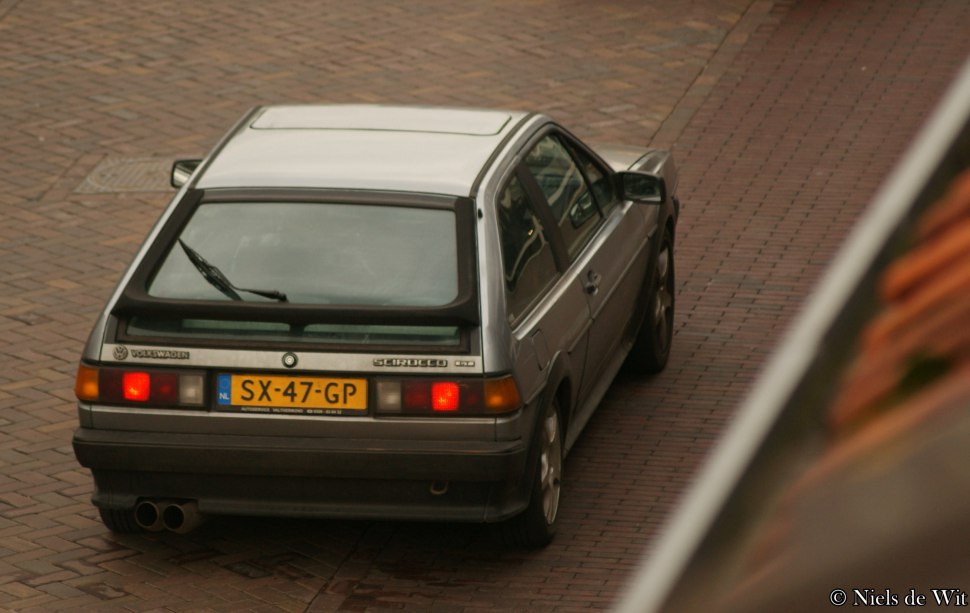 Rear hatchback view with taillights and dual exhaust