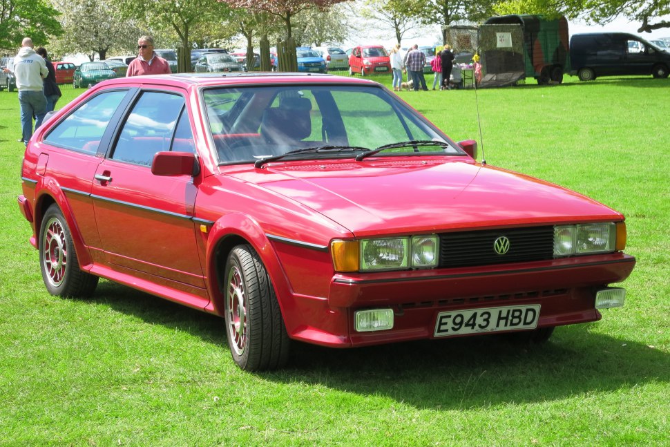 Classic red hatchback with boxy design and rectangular headlights
