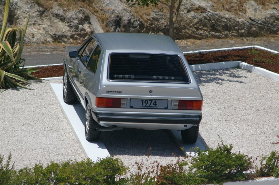 Rear view of a classic 1970s hatchback with distinctive taillights and rear window.