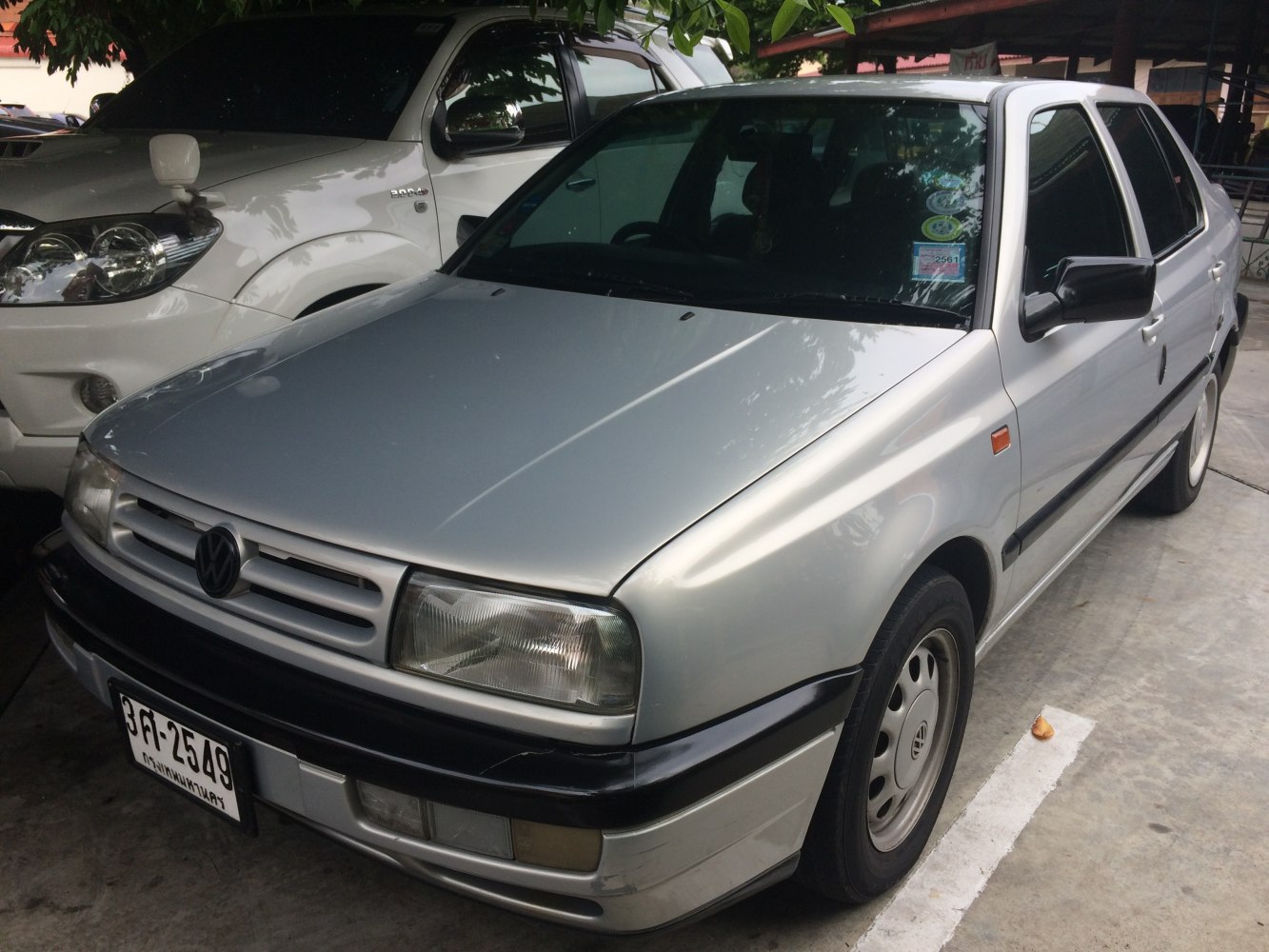 Silver sedan with rectangular headlights and prominent front grille