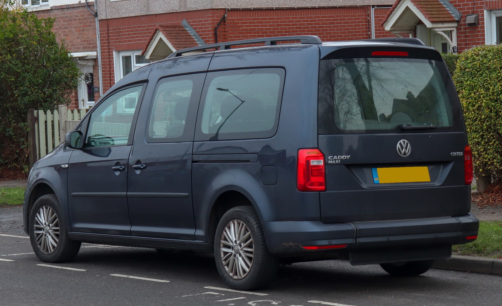 Rear side view with tinted windows and sliding door