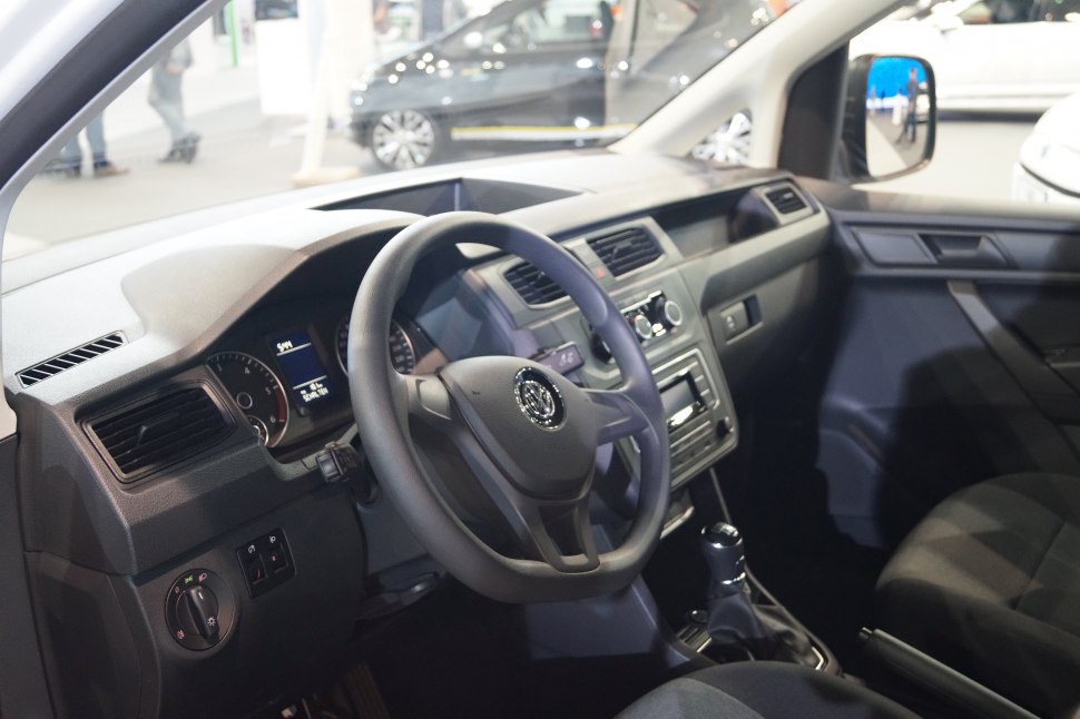 Van interior dashboard with steering wheel and manual gear shift