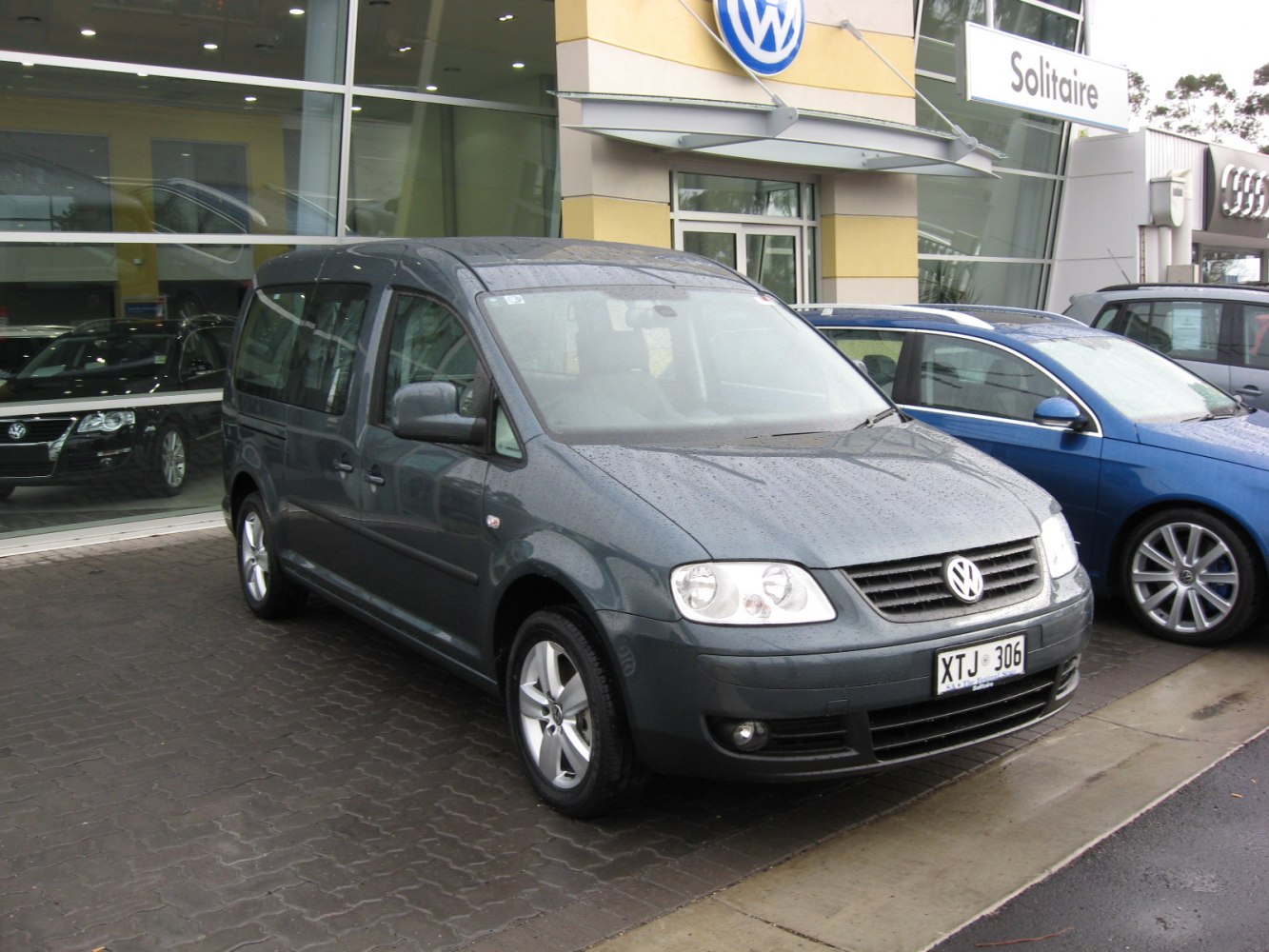 Front and side view of extended van with roofline and alloy wheels.
