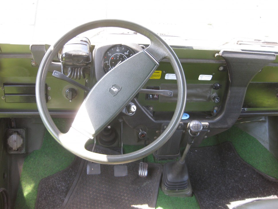 Vintage interior dashboard with steering wheel and manual gear shift