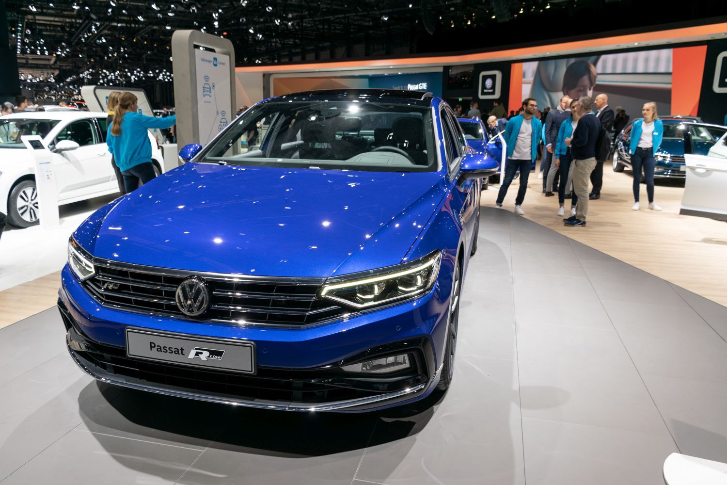 Front view of blue sedan highlighting LED headlights and grille