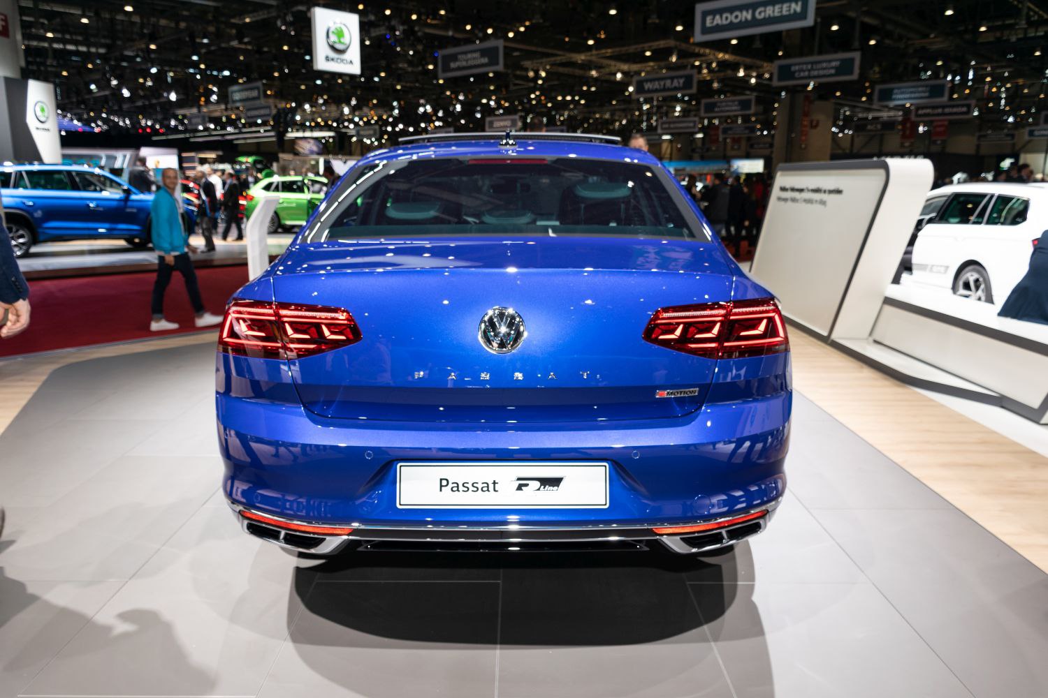 Rear view of a blue sedan with distinctive LED brake lights and R-Line badge
