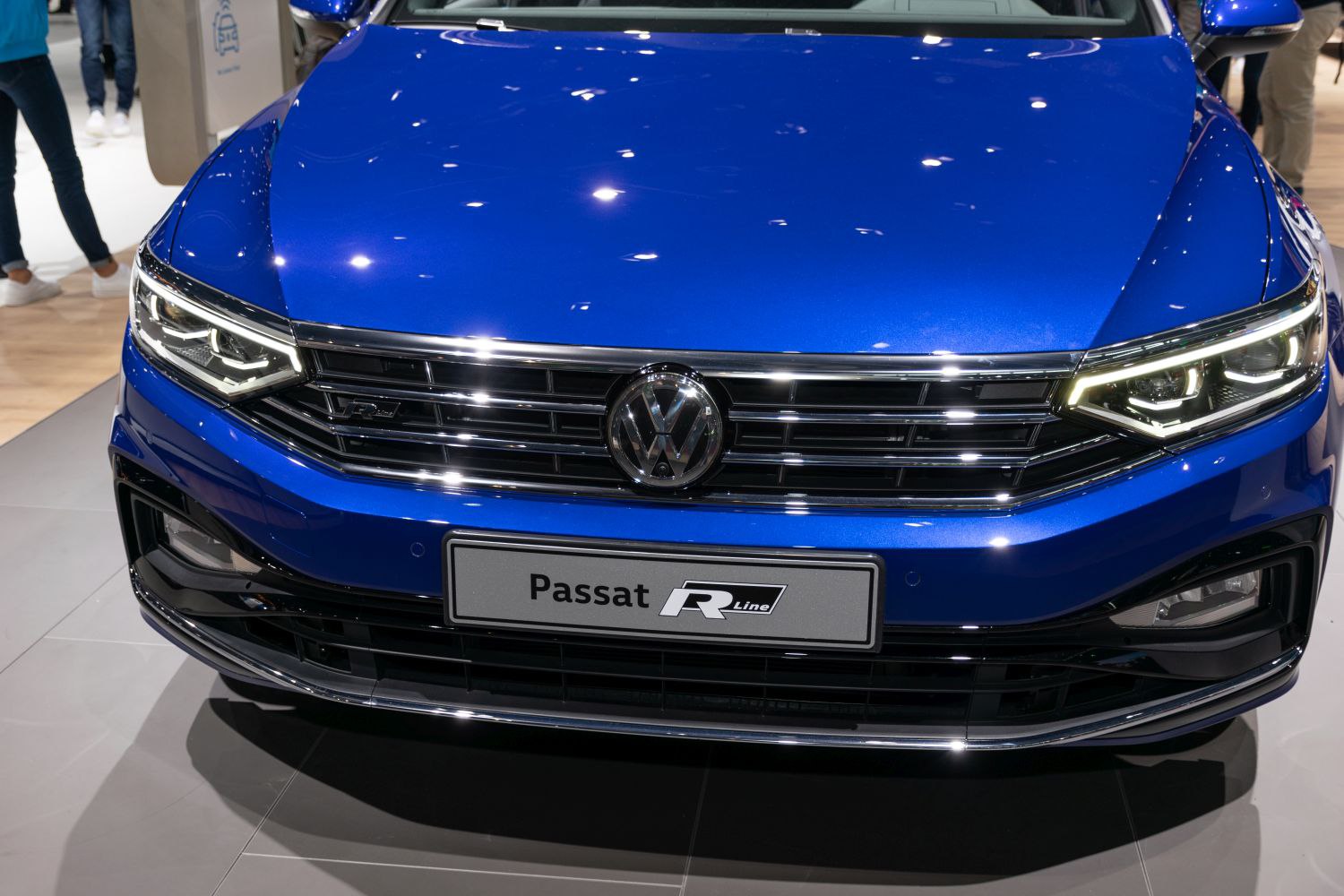 Front grille and LED headlights with chrome trim on blue vehicle