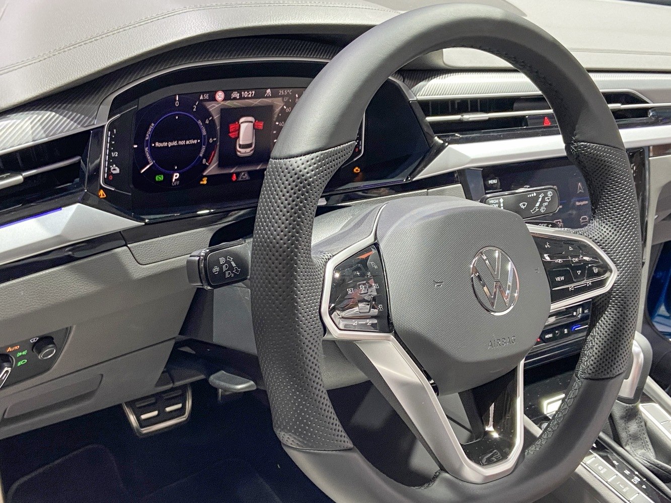 Digital instrument cluster and multifunction steering wheel with controls.