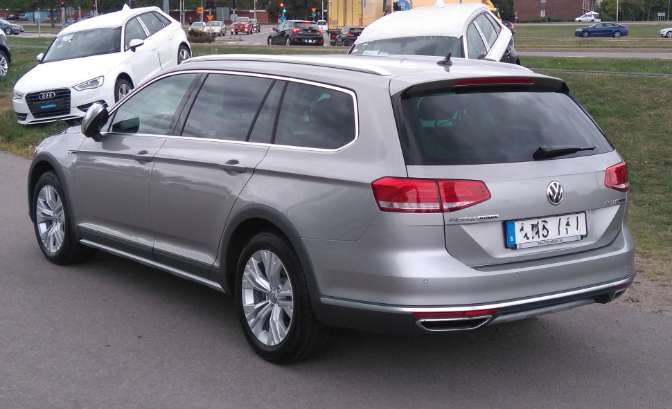 Rear side view of silver estate with tinted windows and modern rear lights
