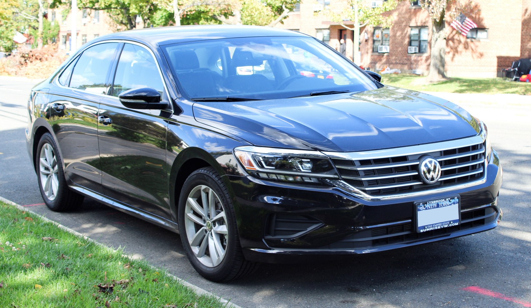 Front side view featuring sleek headlights and chrome grille