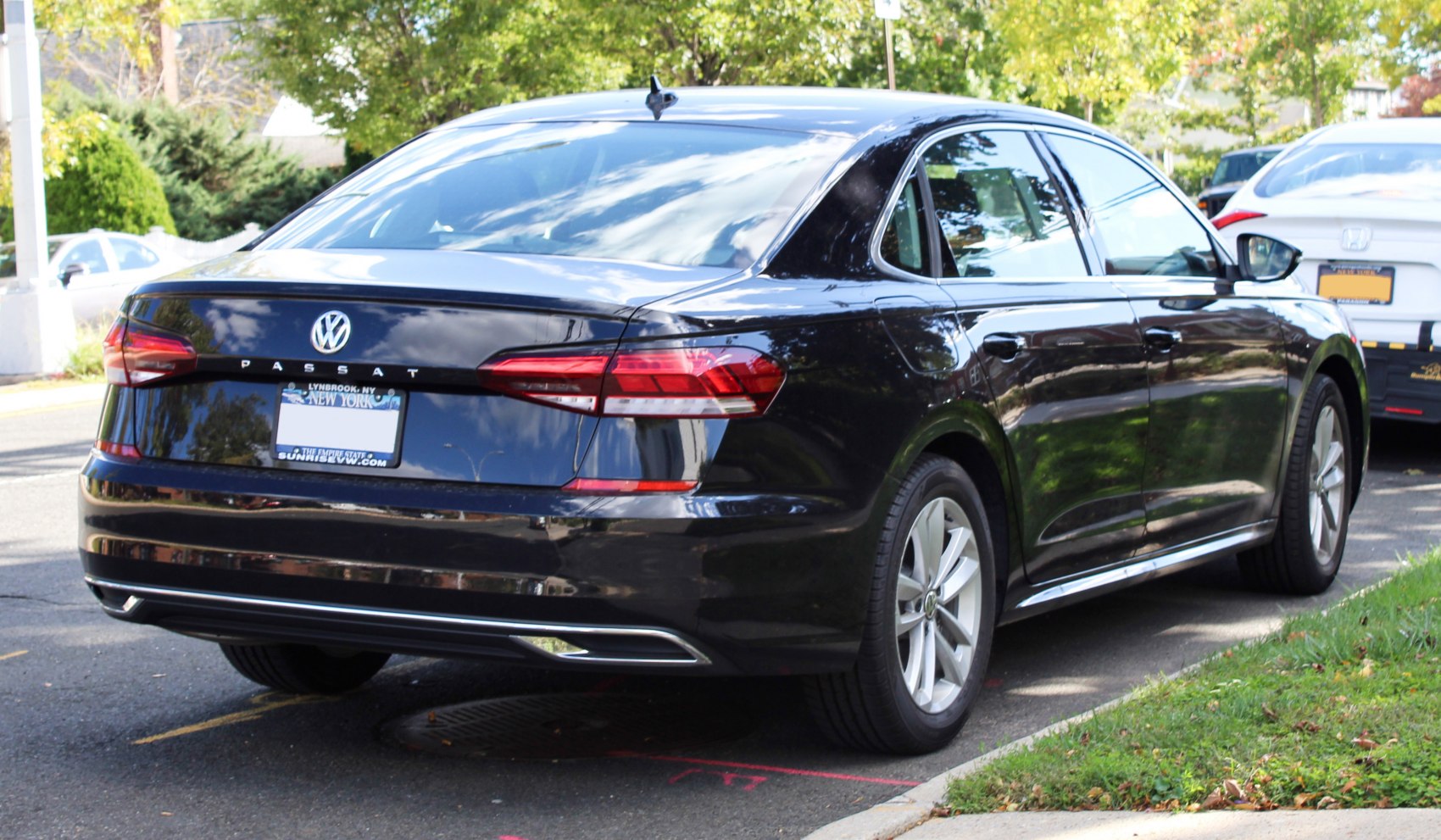 Rear side view with modern taillights and aerodynamic sedan design