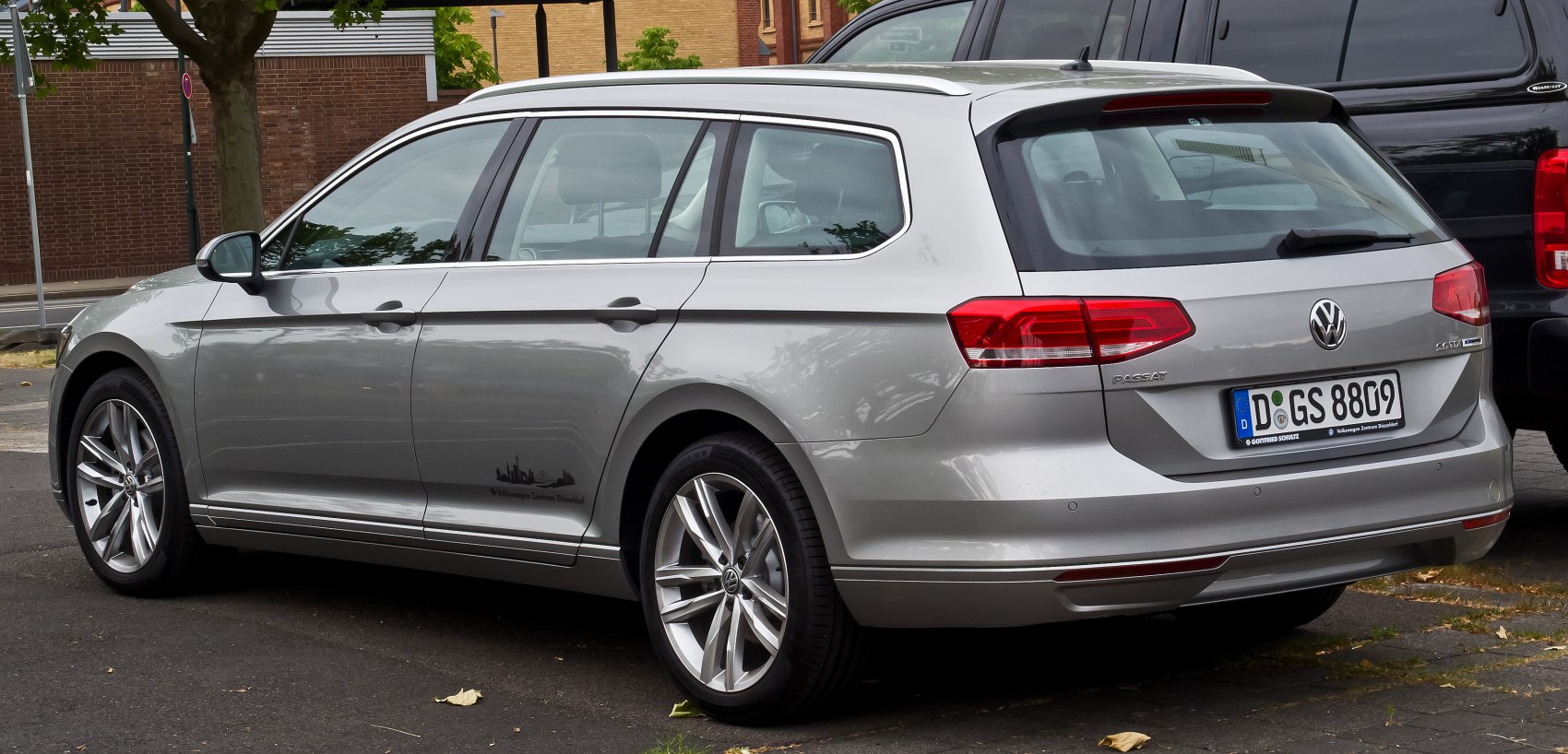 Sleek rear view of silver estate car with modern taillights