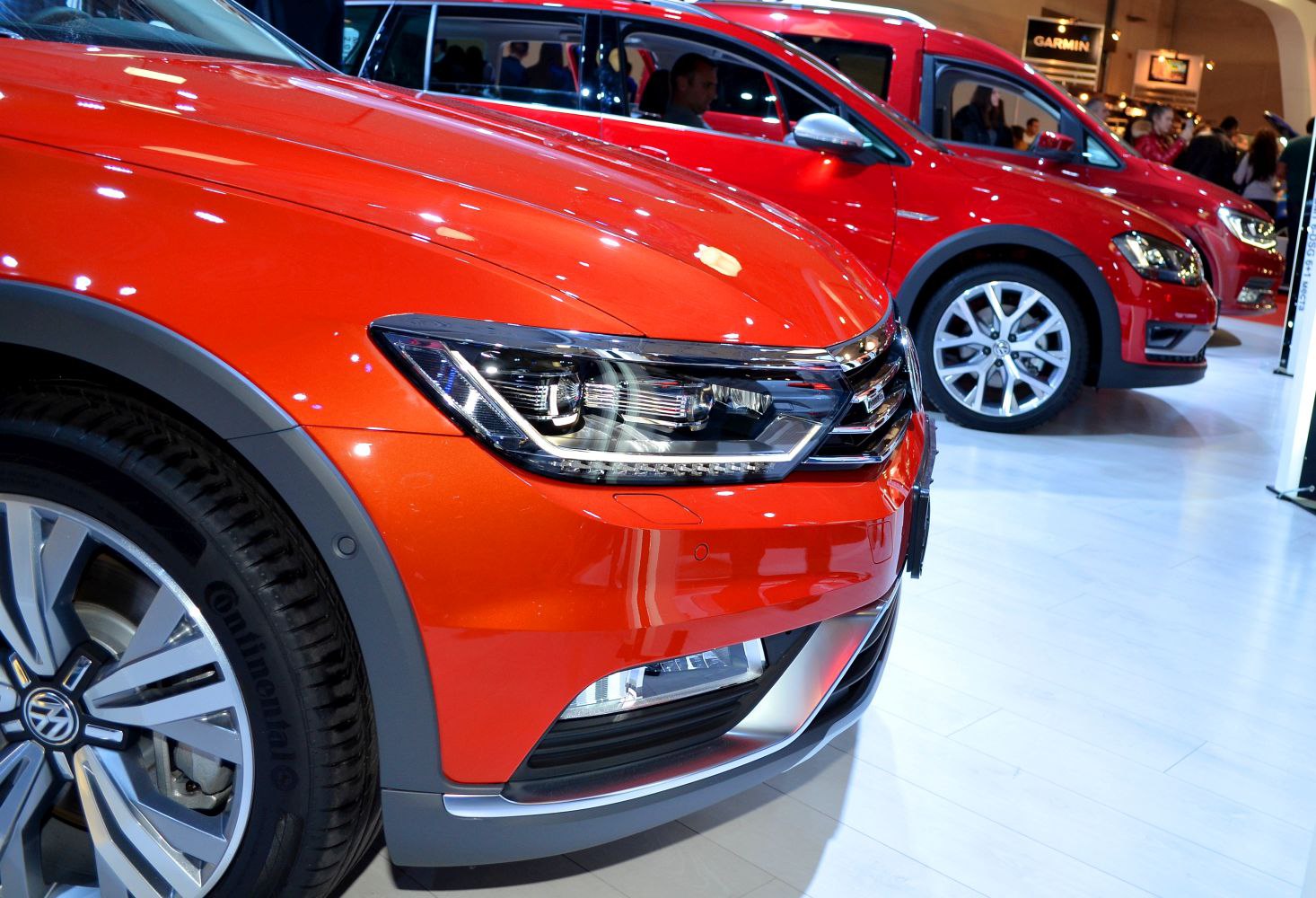 Close-up of front headlight and wheel with rugged trim