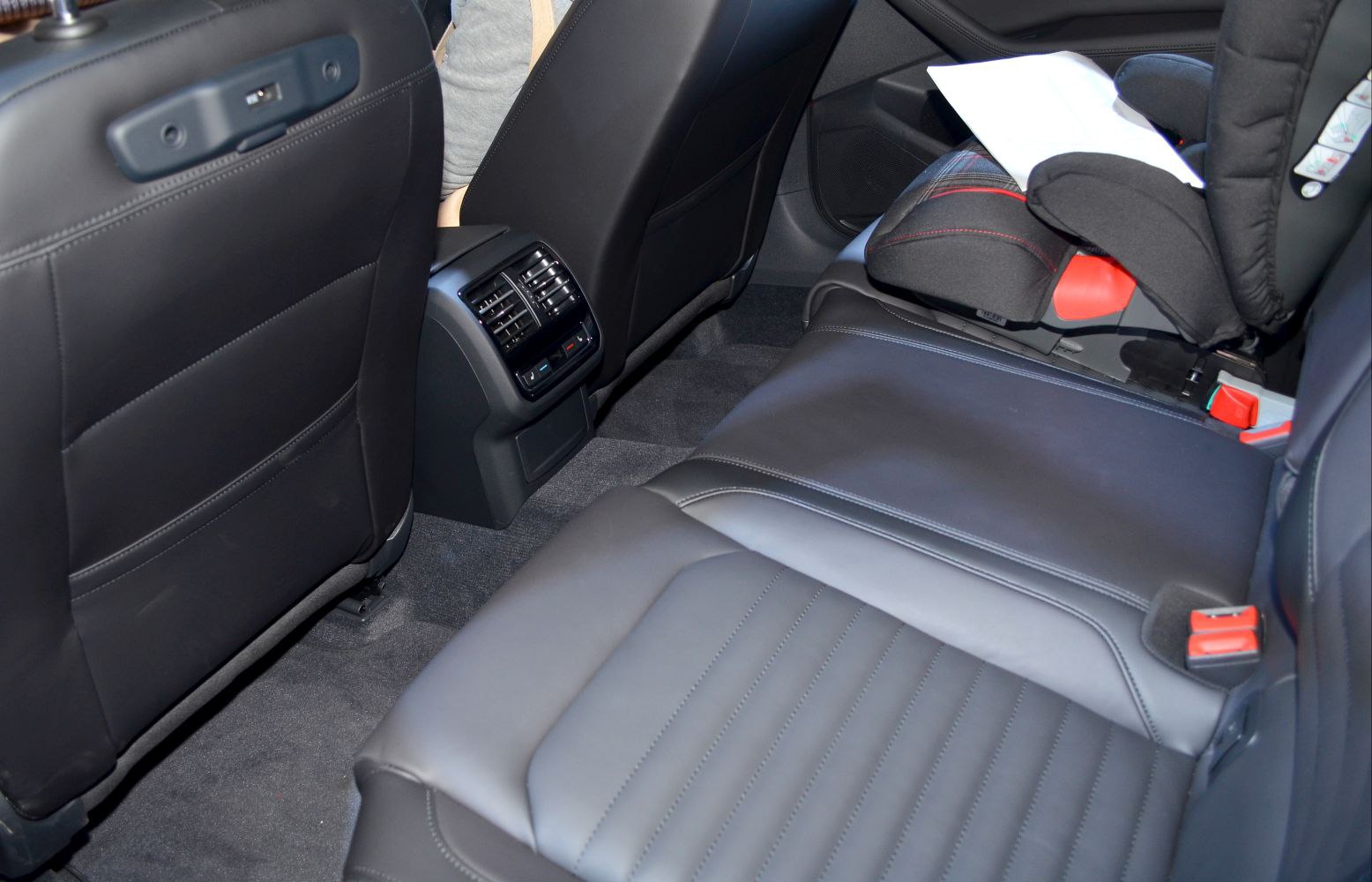 Rear seat leather interior with child seat and rear air vents