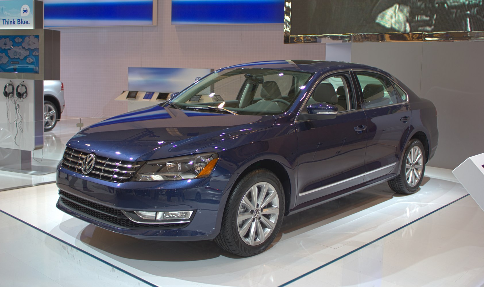Blue four-door sedan with alloy wheels and modern styling