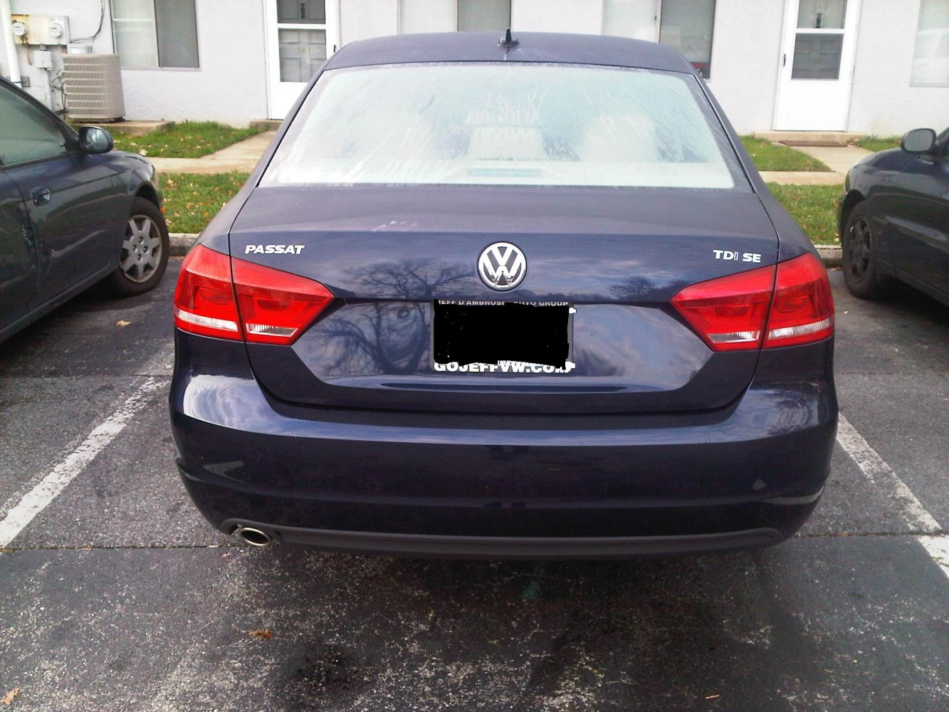 Rear view of a sedan with distinct taillights and single exhaust pipe