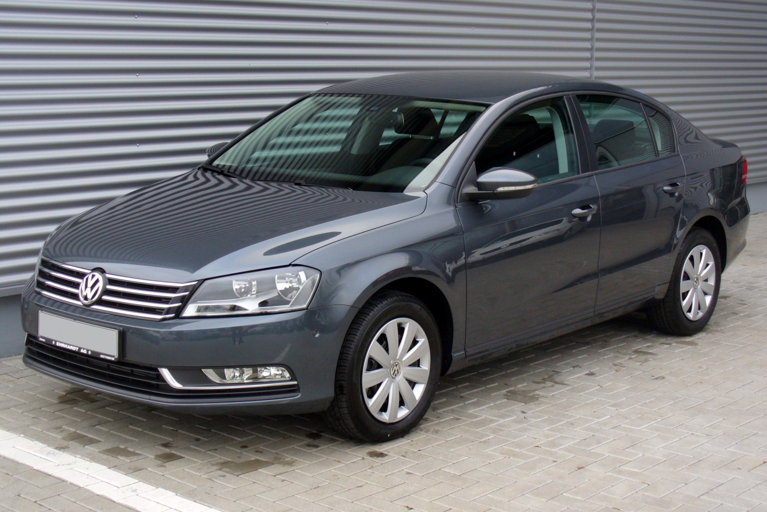 Front side view of a 2010 sedan with distinct headlights and grille