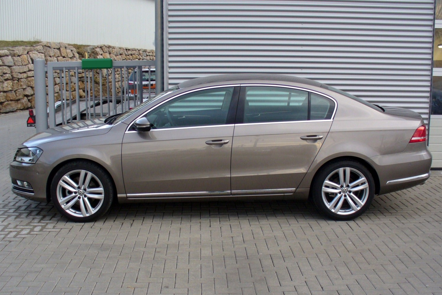 Side profile of a mid-size sedan with alloy wheels and smooth body lines