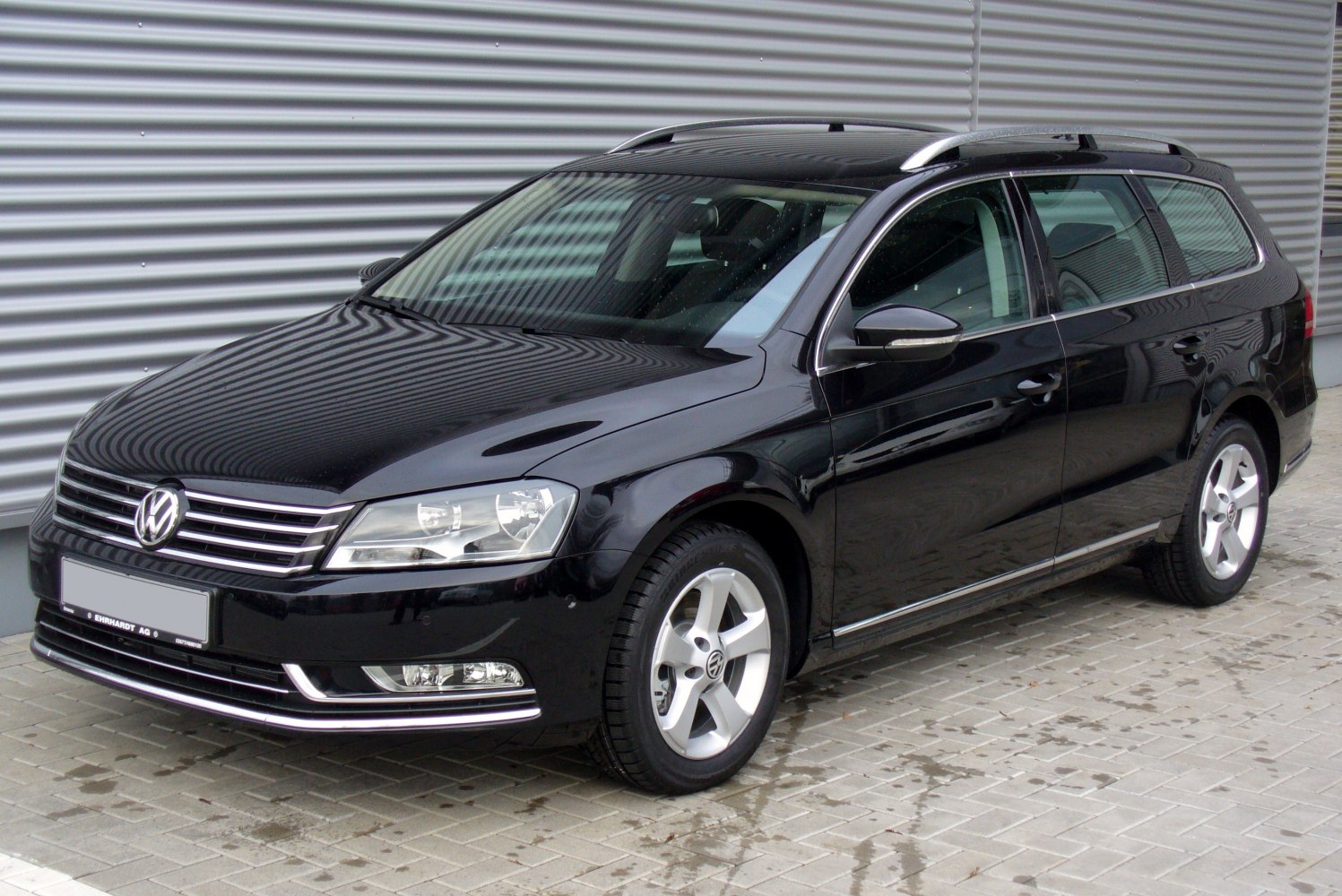 Black station wagon with roof rails and alloy wheels