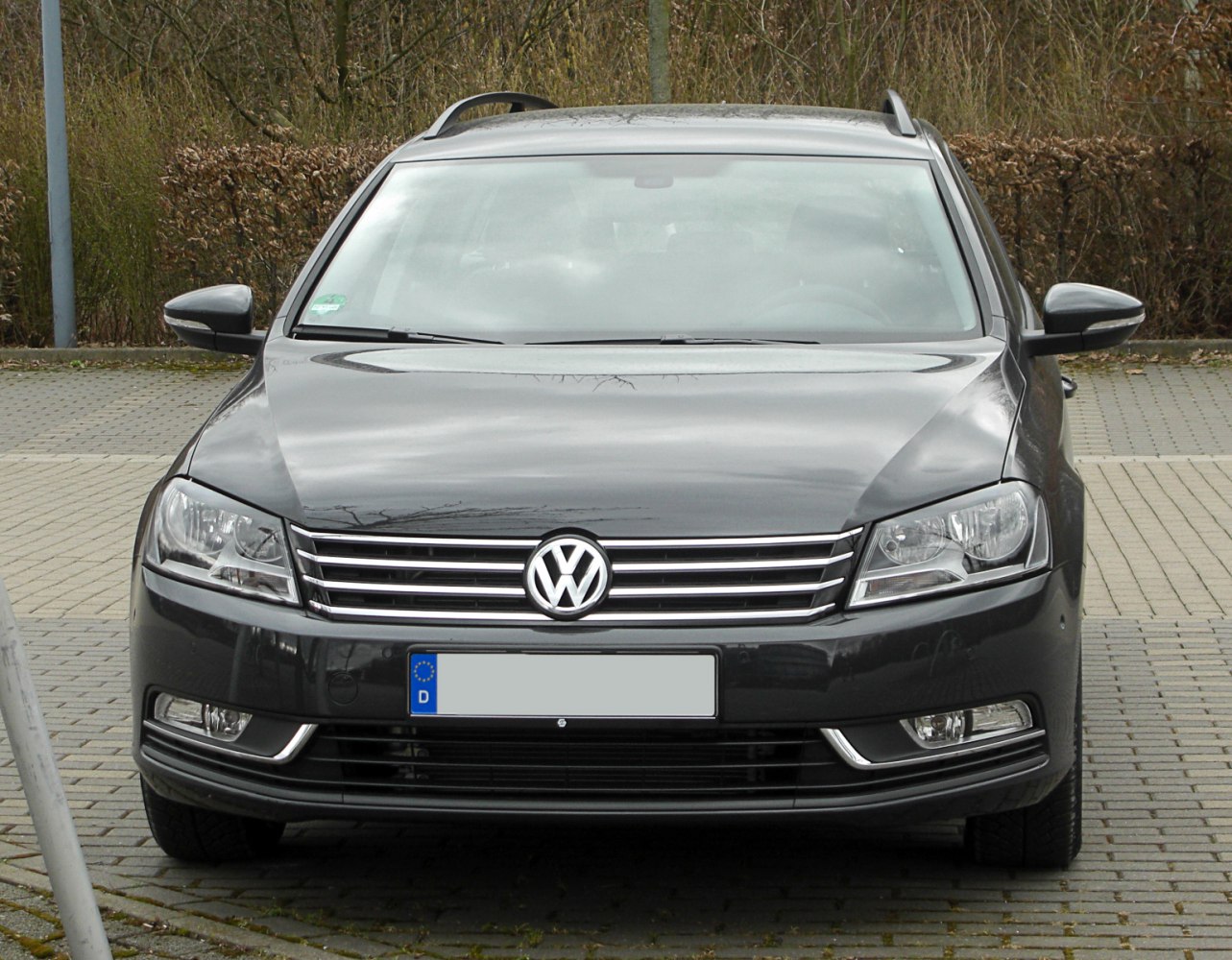 Front view showing headlights, grille, and bumper fog lights