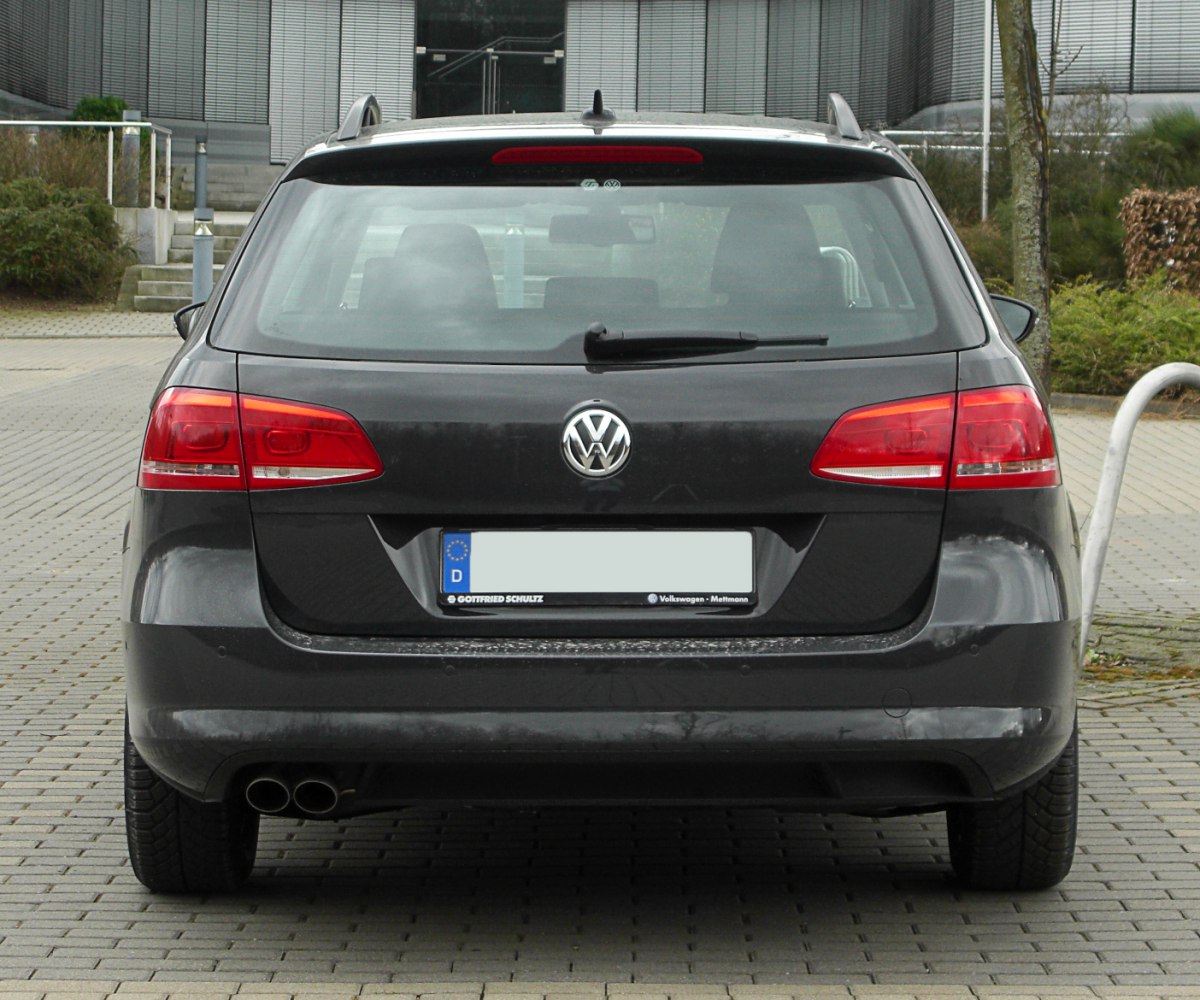 Rear view showing taillights, dual exhaust, rear windshield with wiper