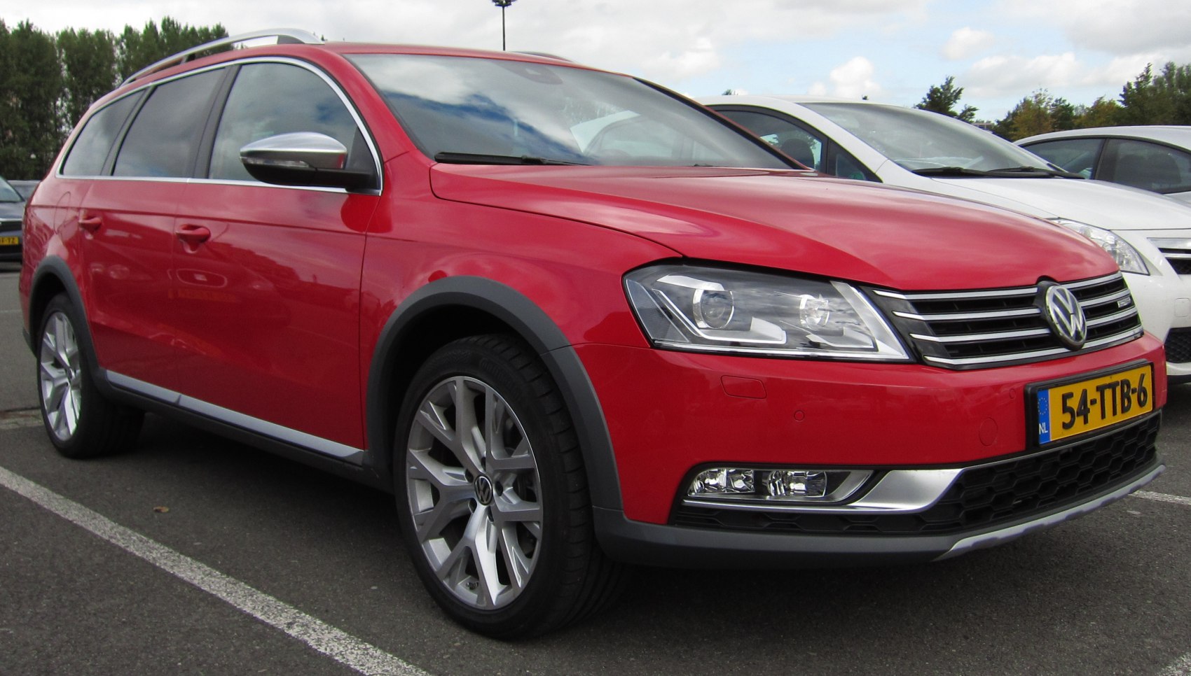 Robust red estate with roof rails and alloy wheels