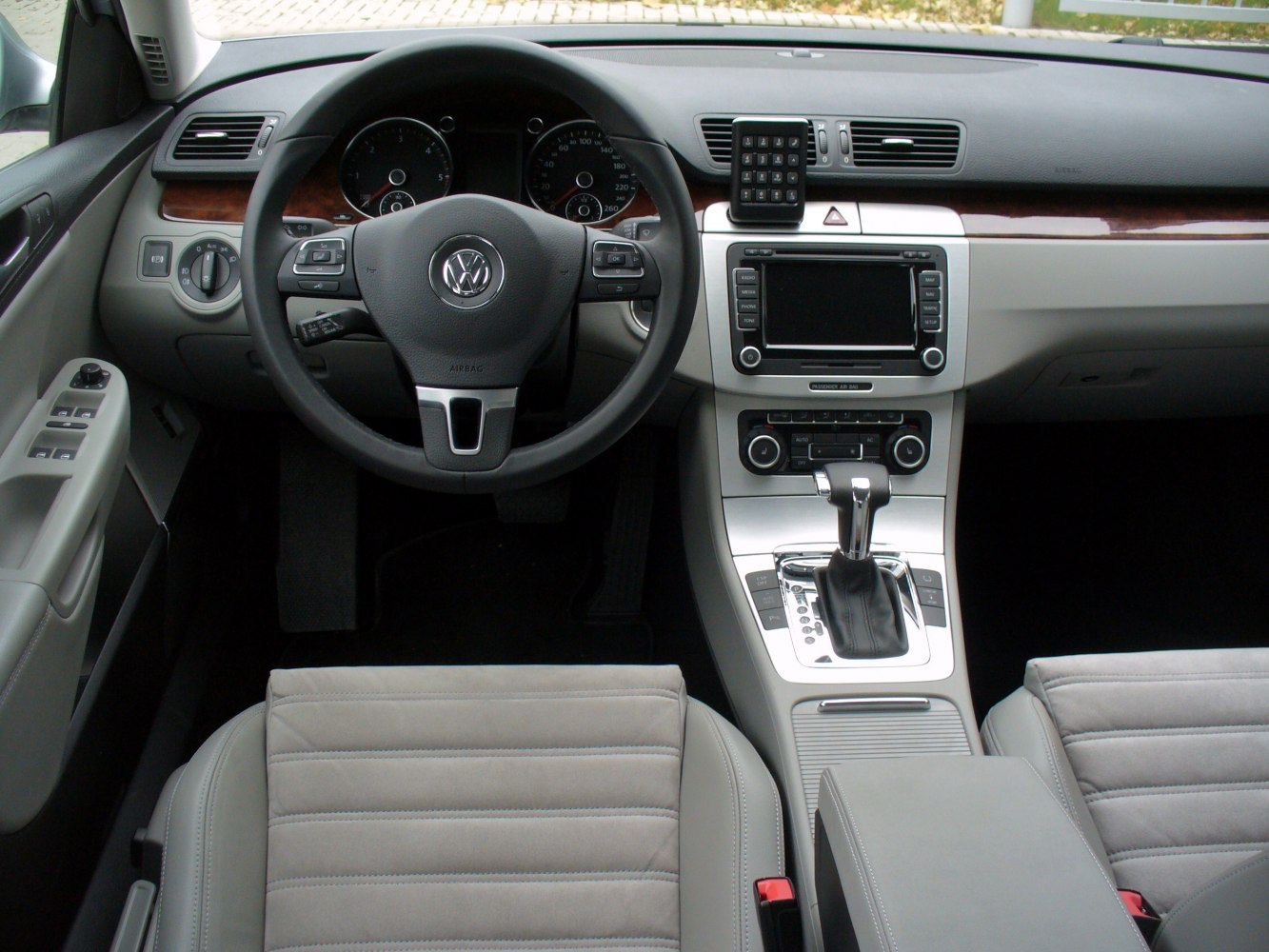Car interior dashboard with steering wheel and gear shifter