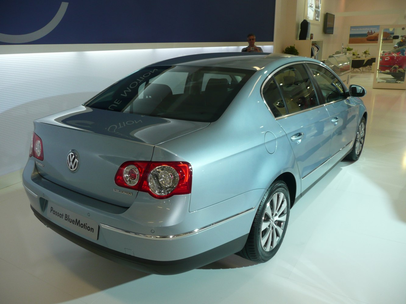 Rear and side exterior with circular taillights and alloy wheels