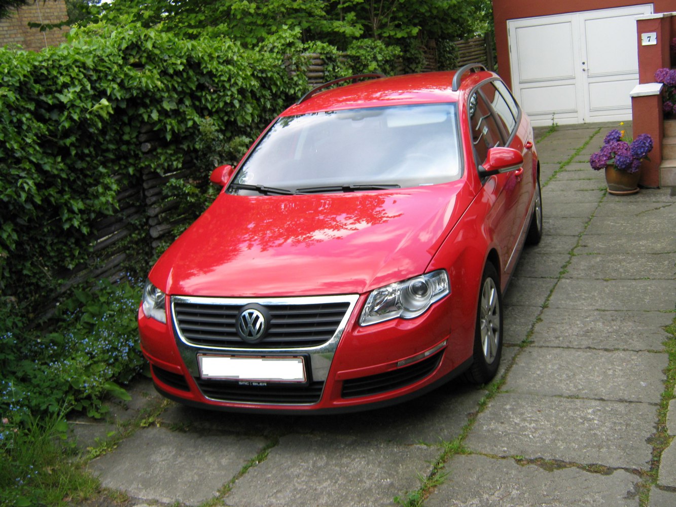 Front view of red station wagon with distinctive grille and headlights