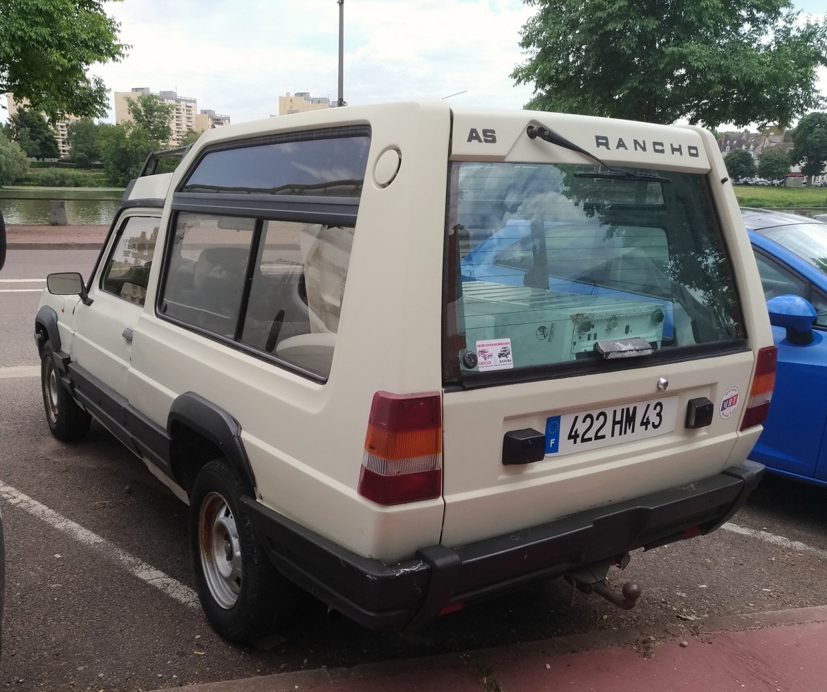 Classic SUV rear view with boxy design and distinctive tail lights