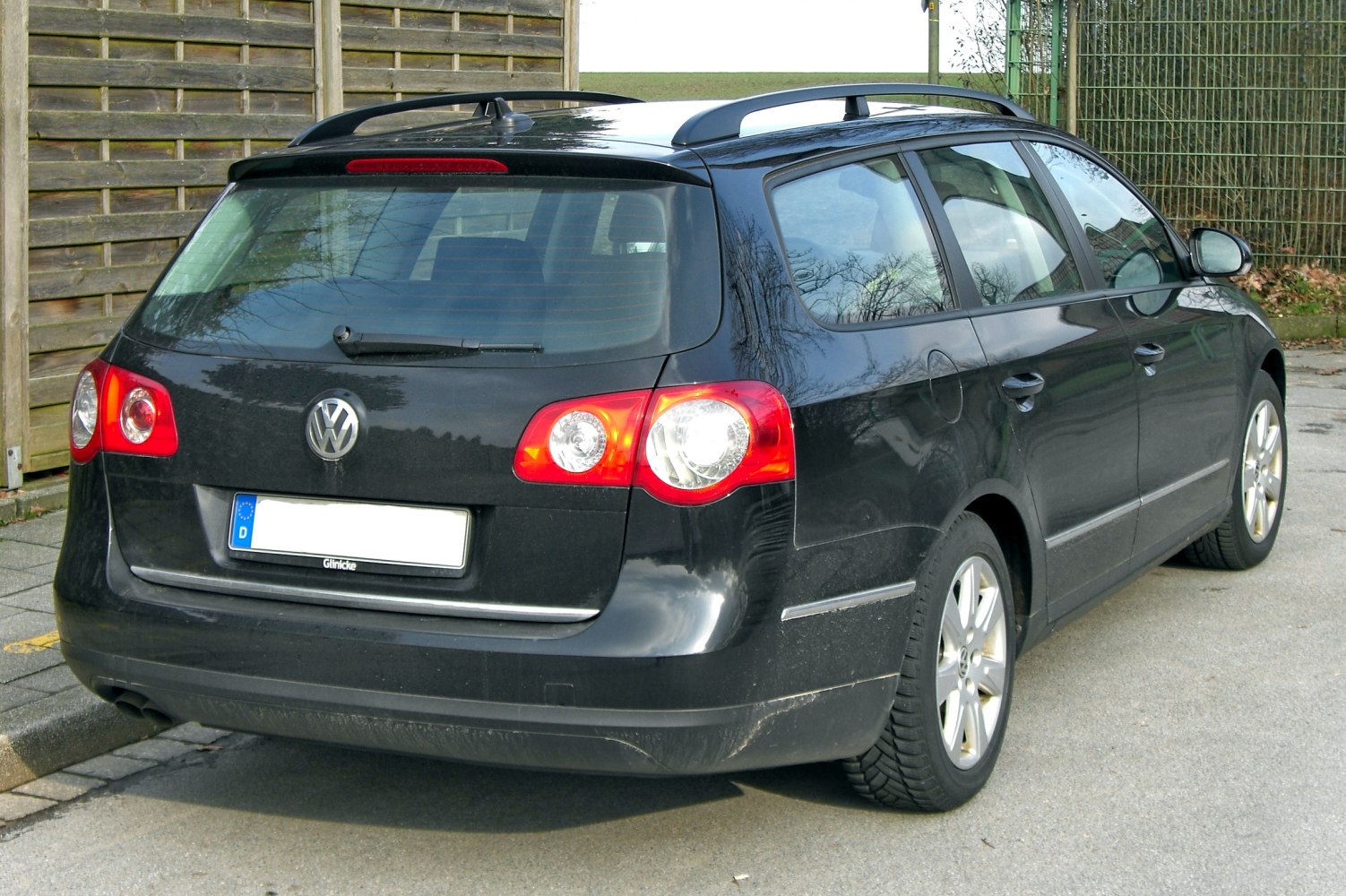 Rear view of station wagon with roof rails and distinct taillights
