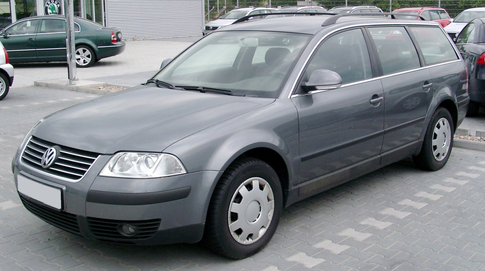 Grey mid-2000s wagon with front grille and alloy wheels