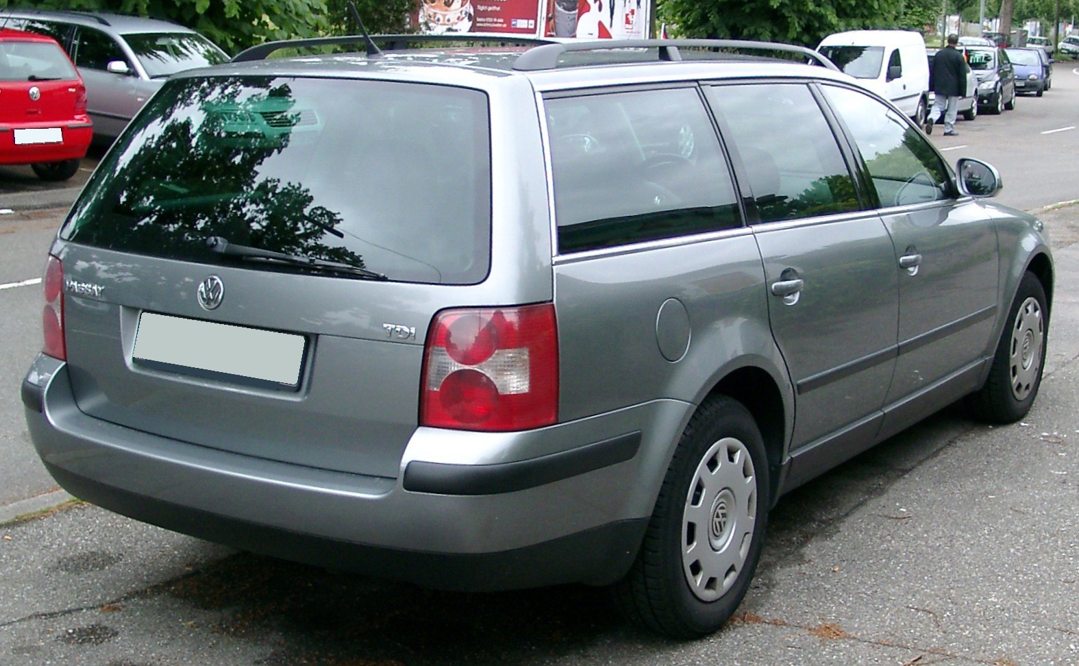 Rear and side view of a station wagon with TDI badge and roof rails