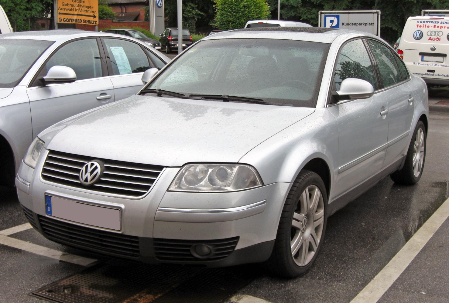 Silver sedan with horizontal grille and dual headlights