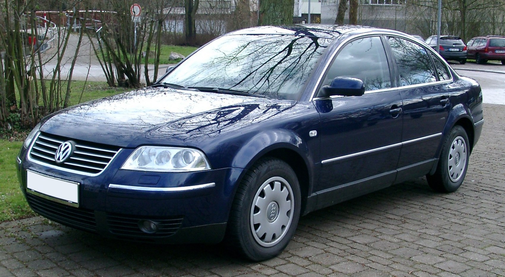 Front side view of a classic mid-size sedan with distinct headlights