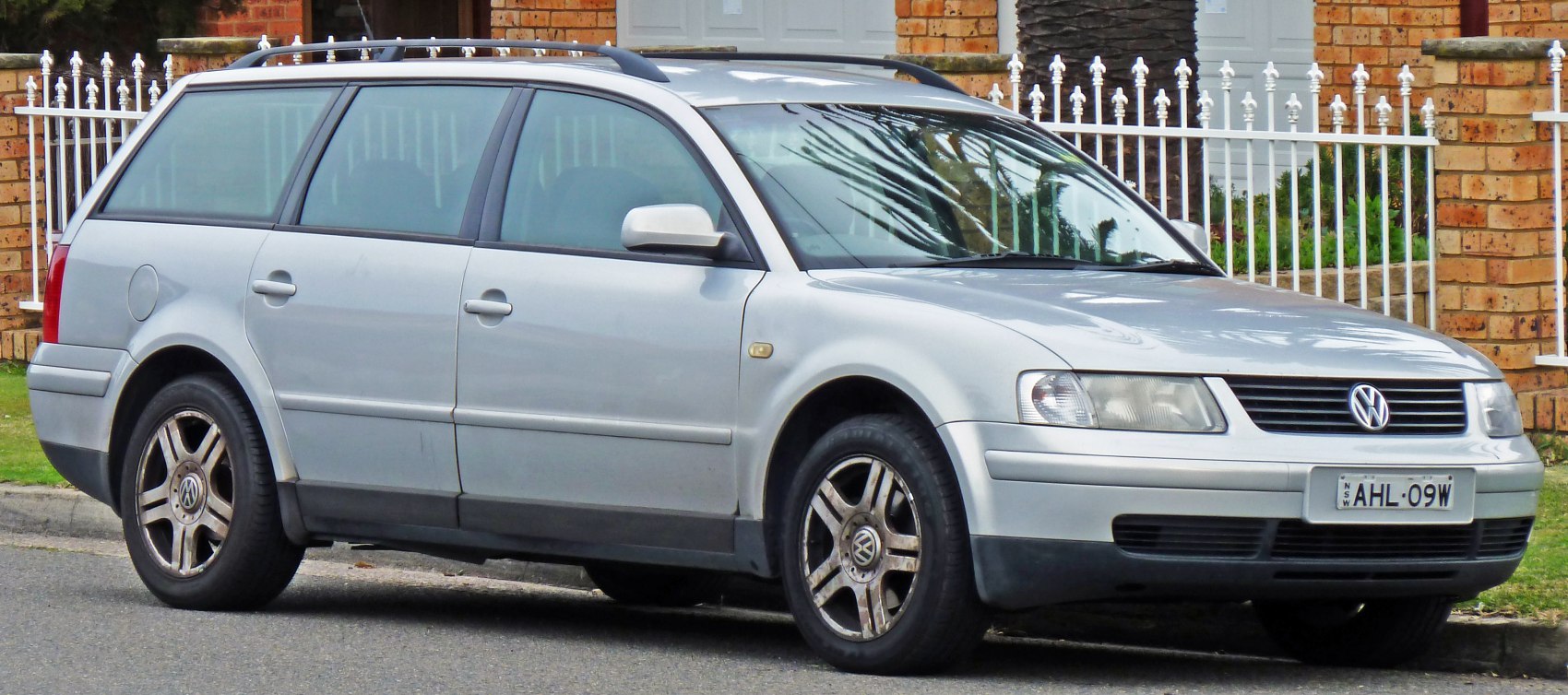 Silver station wagon with alloy wheels and roof rails