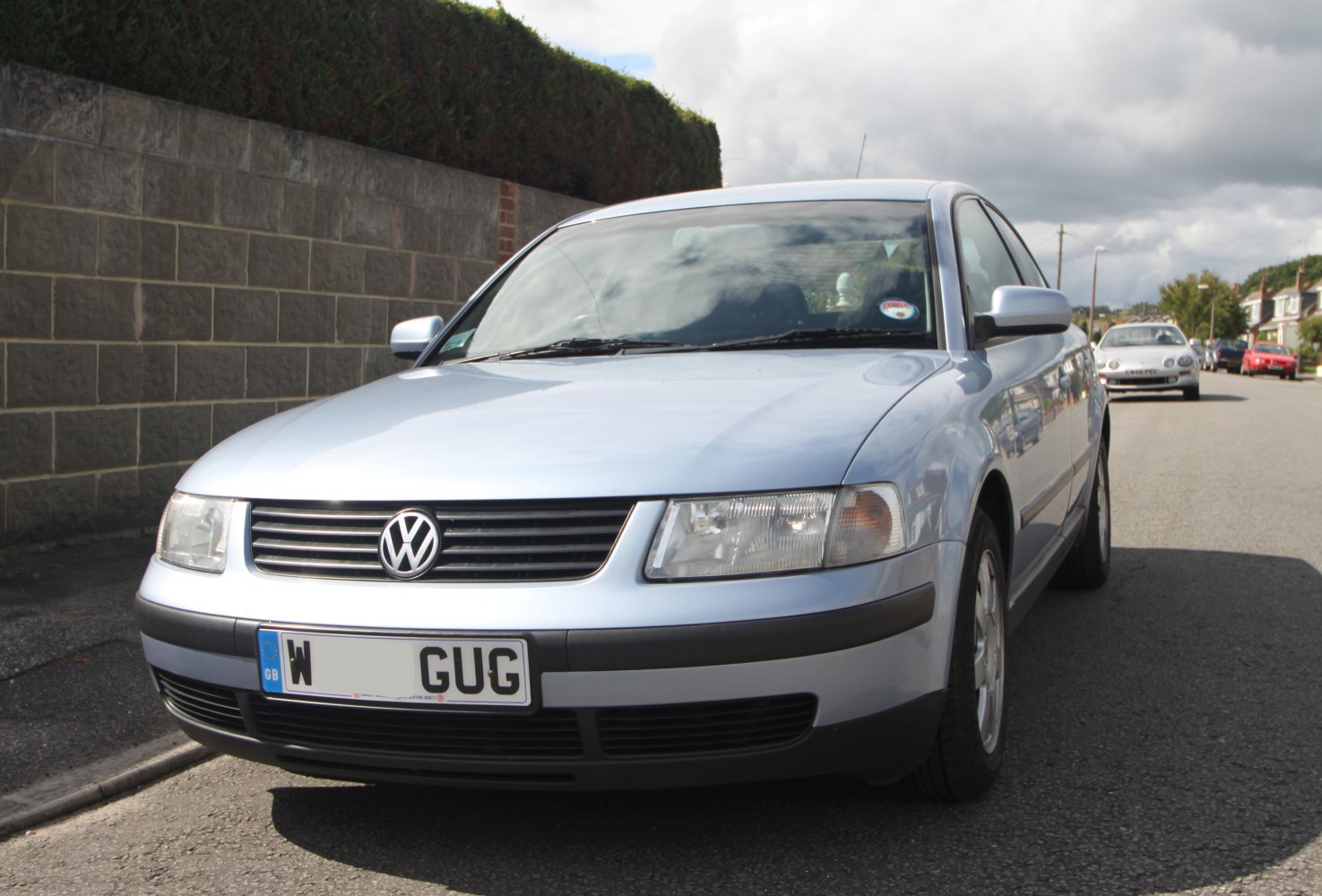 Front view of mid-90s Volkswagen Passat B5 sedan with classic grille and headlights