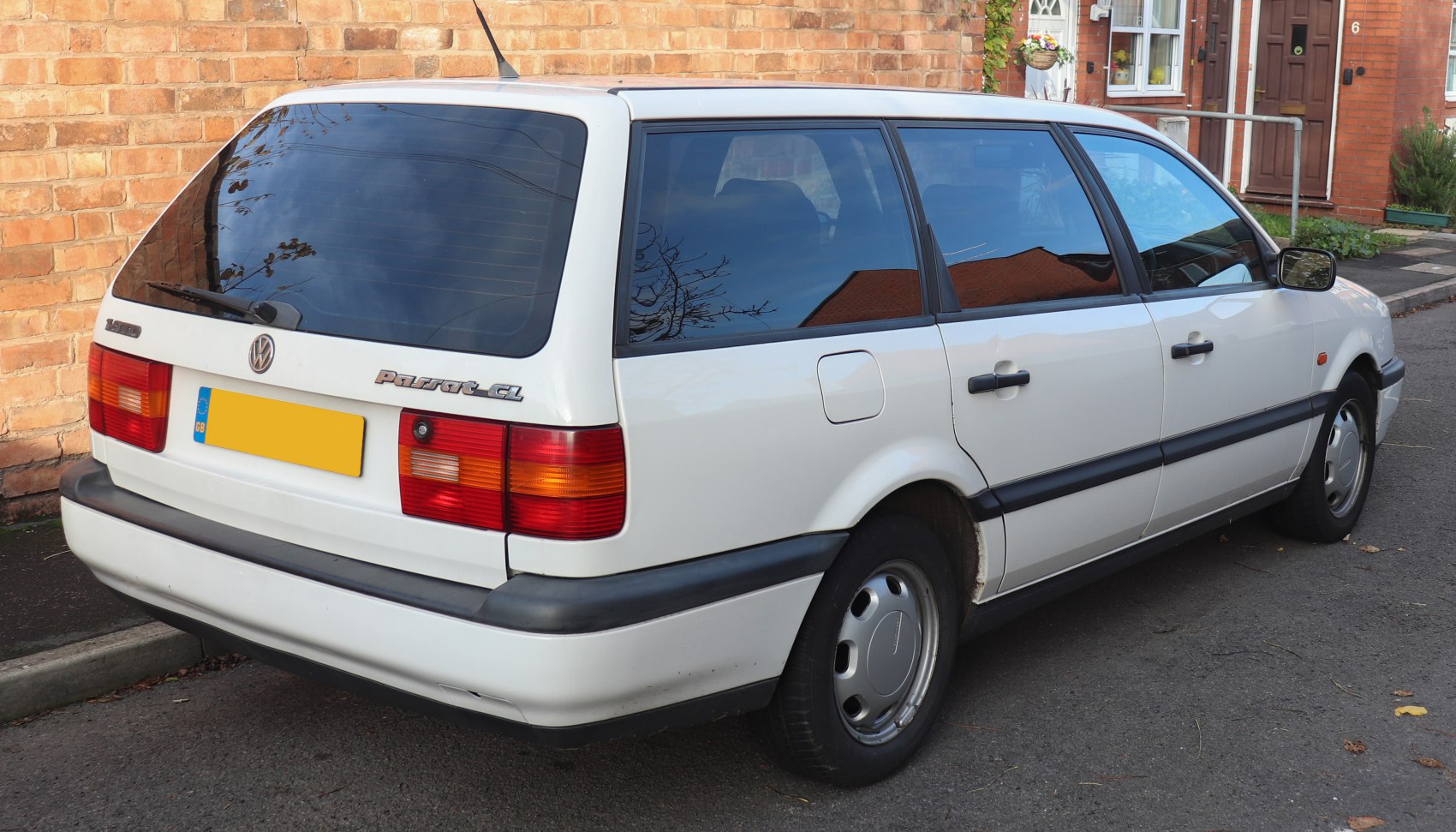 Rear and side view of estate car with tinted windows and black trim