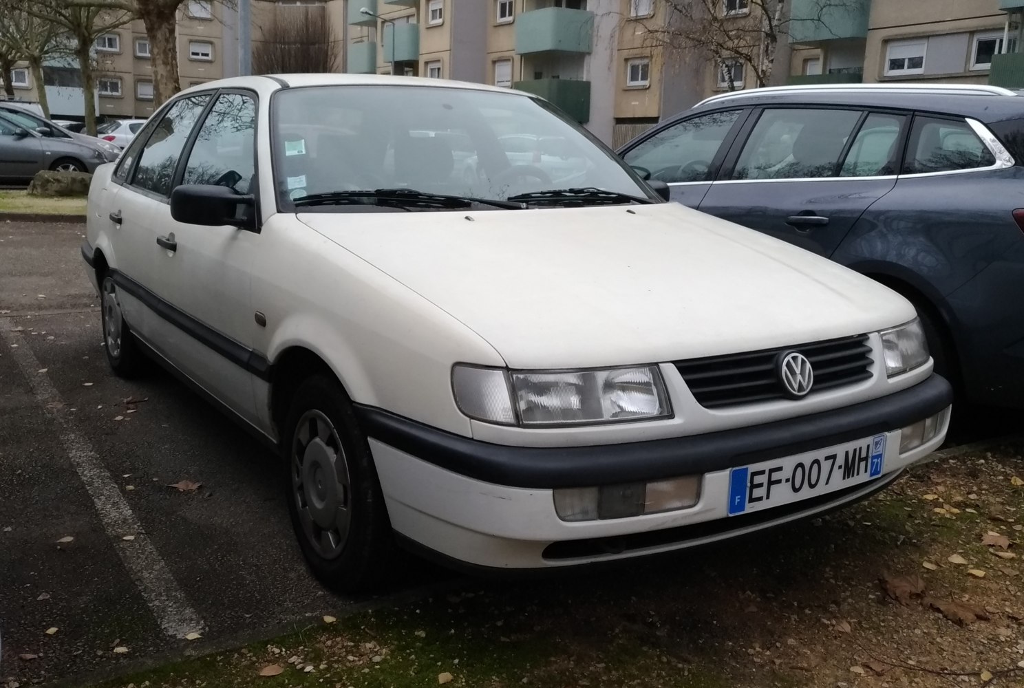 White classic sedan with rectangular headlights and black grille