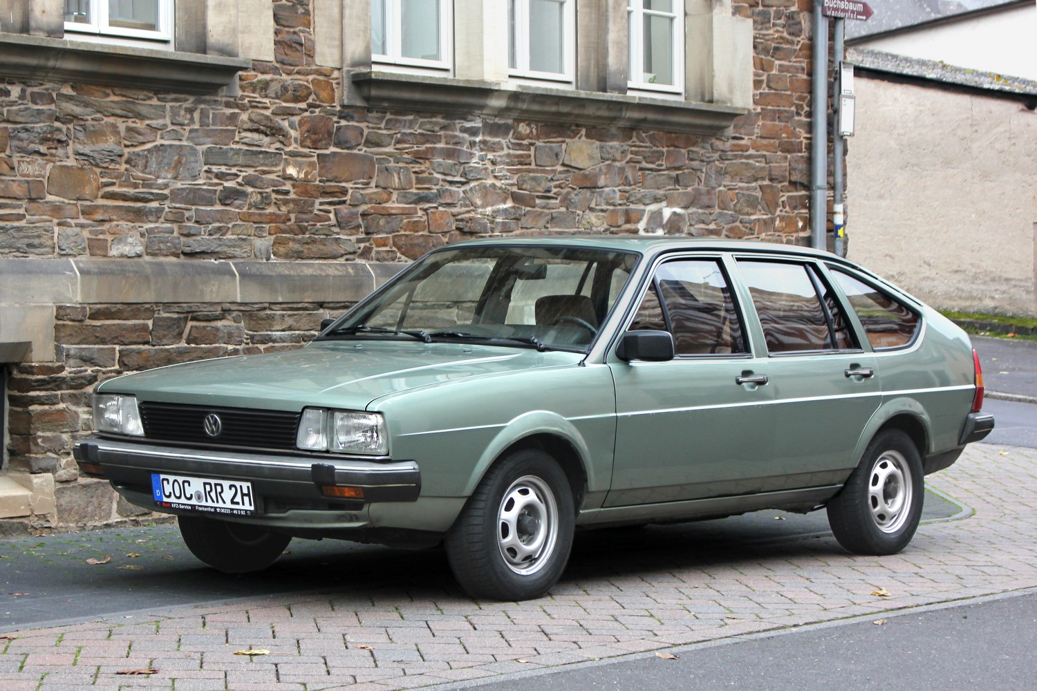 1980s hatchback with rectangular headlights and smooth body panels