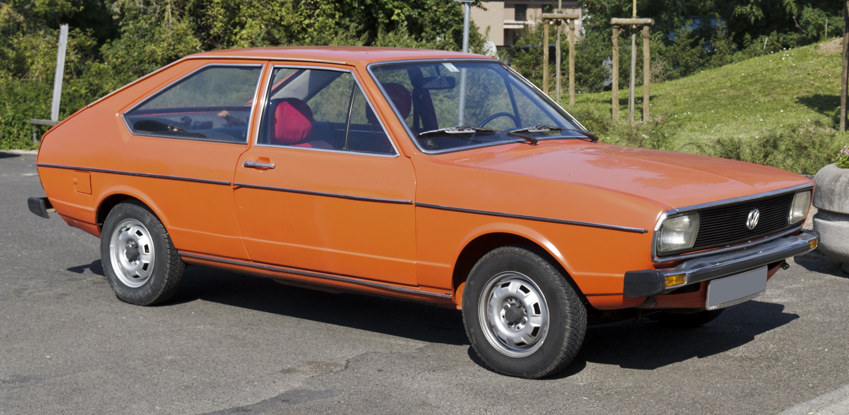 Classic 1970s hatchback side profile with chrome trim and vintage wheels