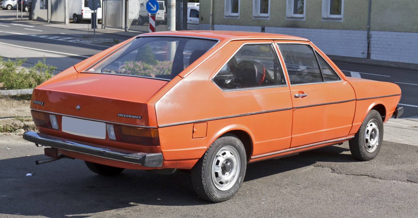 Rear-angle view of vintage hatchback with angular shape and black bumper