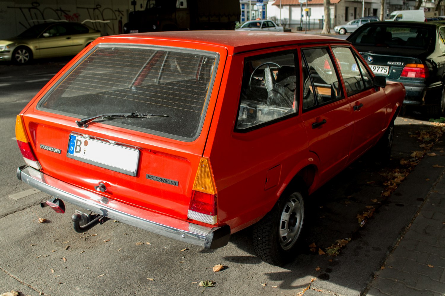 Rear view of a vintage boxy station wagon with angular taillights and rear window wiper