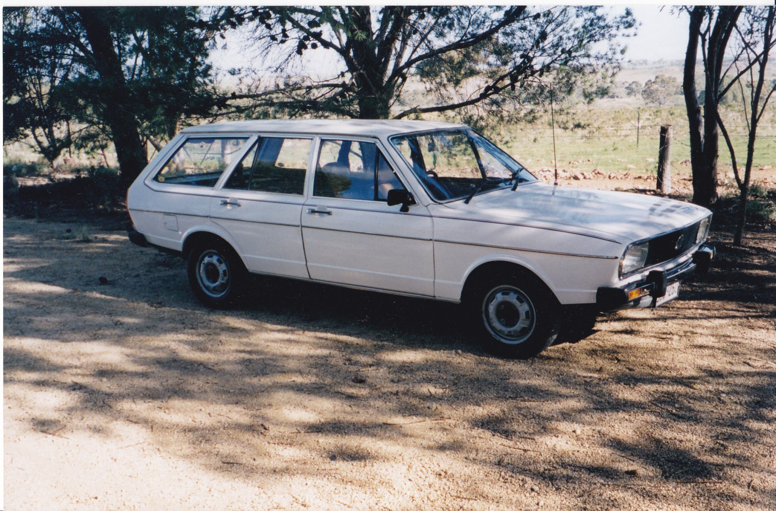 Side profile of 1970s vintage station wagon with boxy design and four doors