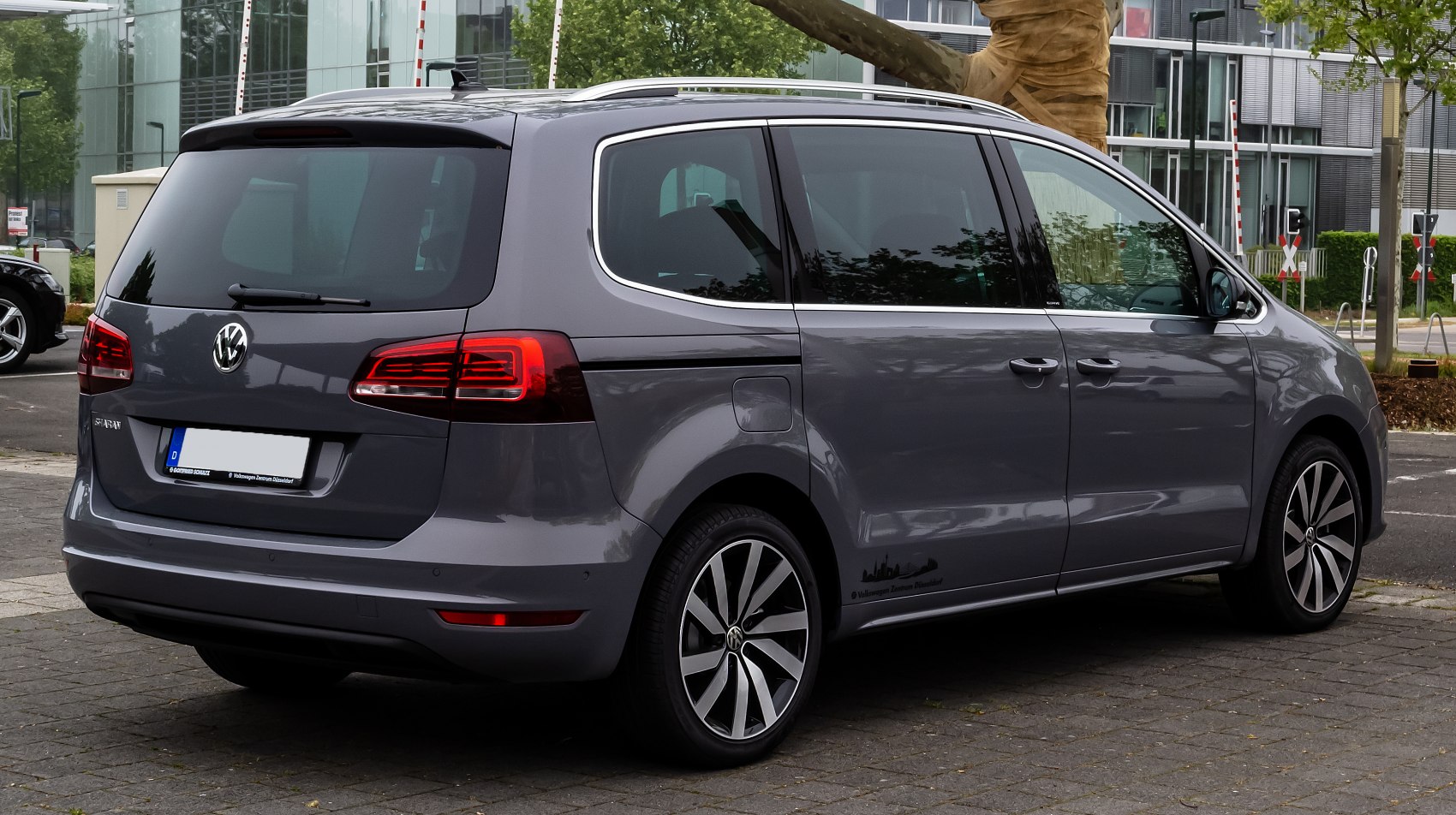 Rear and side view showing taillights, sliding doors, alloy wheels